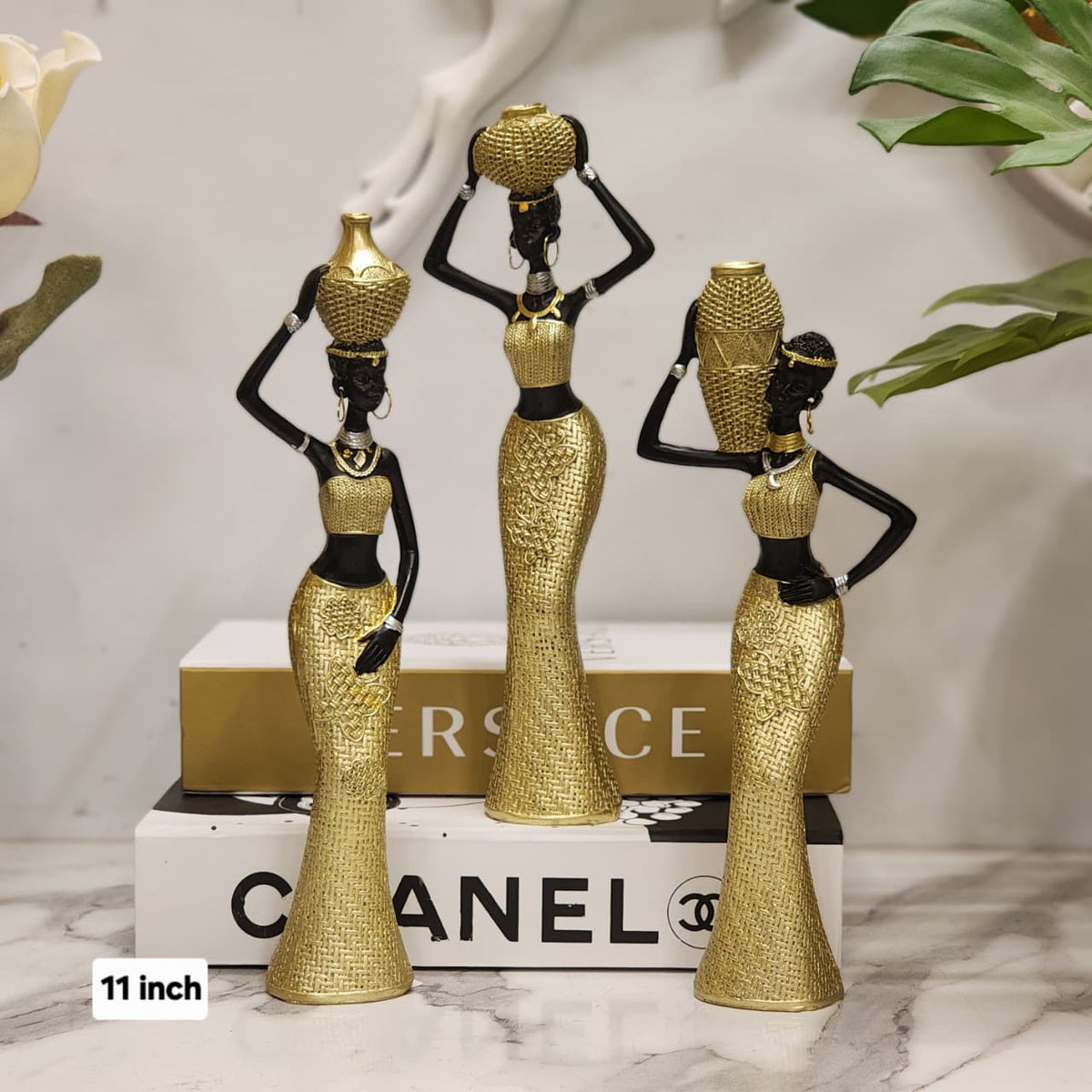 Ethnic art decor depicting women with water jugs on heads