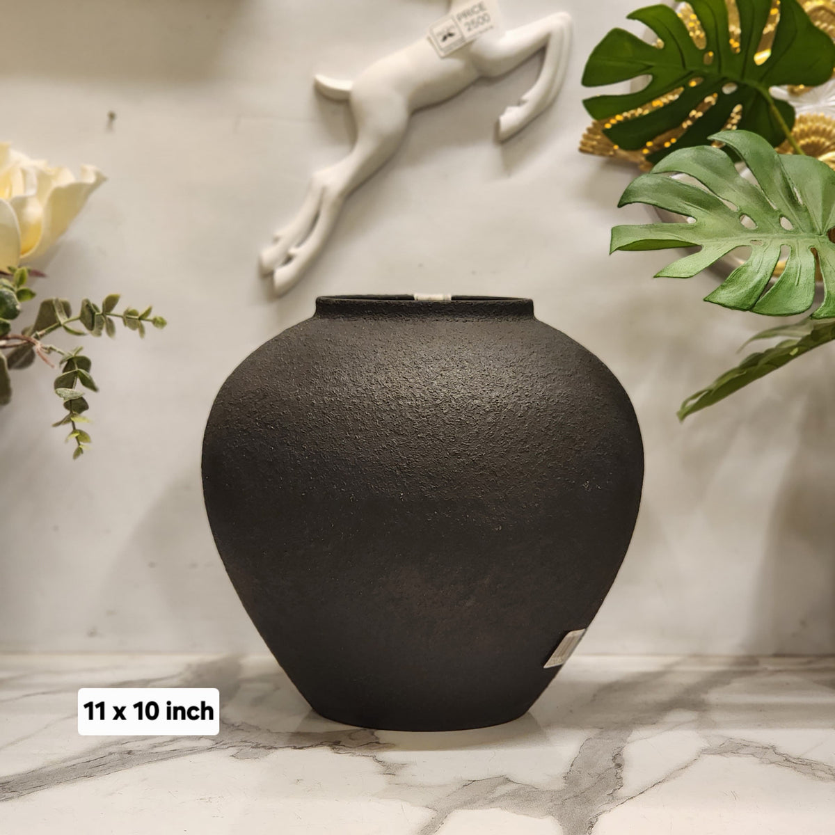black textured ceramic rounded vase