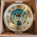 ATCO Gold Gear Wall Clock with a green dial