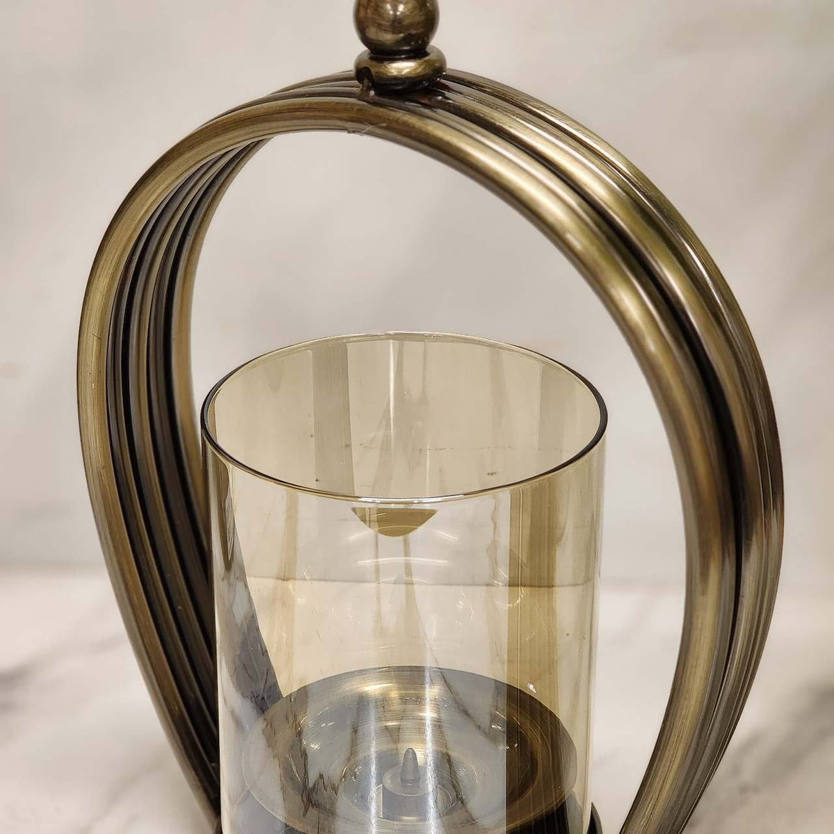 Modern Curved Metal Candle Stand with Amber Glass Hurricane
