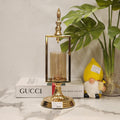 gold metal and glass candle holder