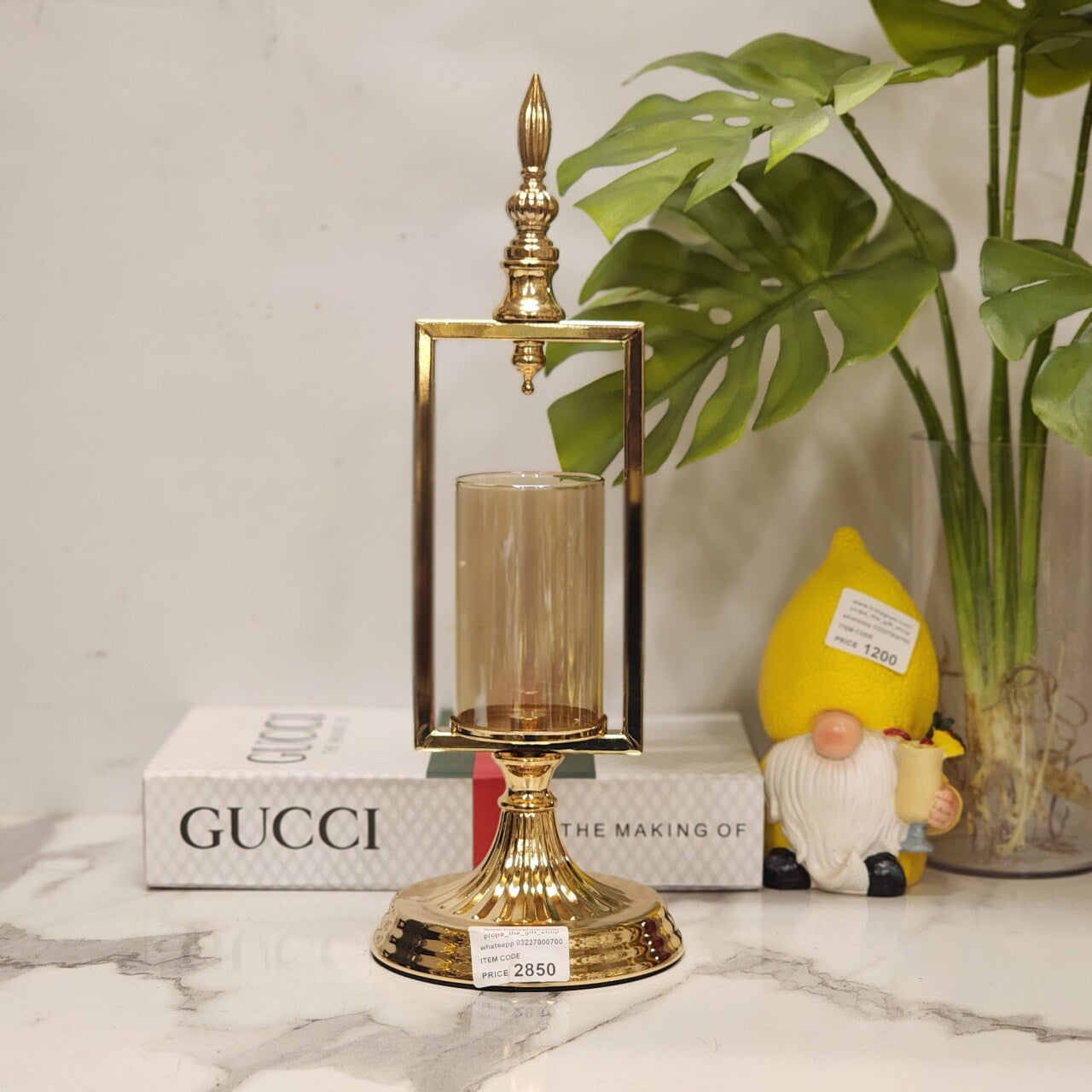 gold metal and glass candle holder