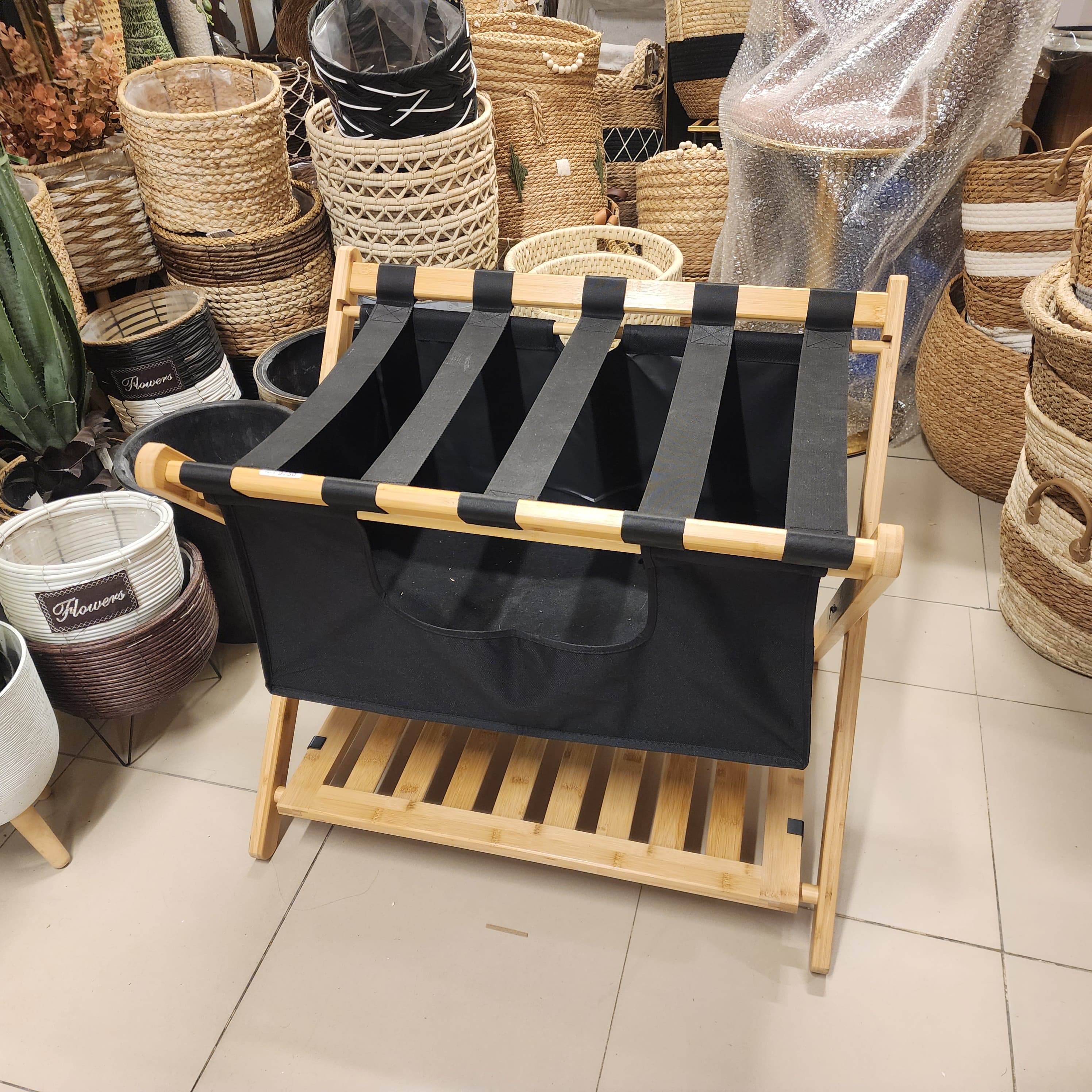 folding luggage rack with a built-in laundry basket/storage