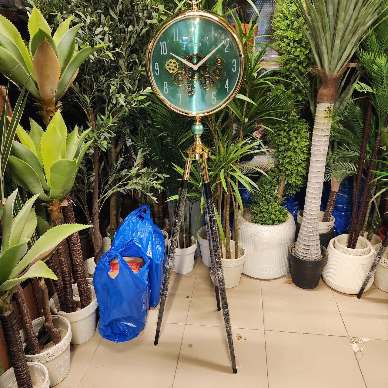 vintage-style moving gear tripod floor clock