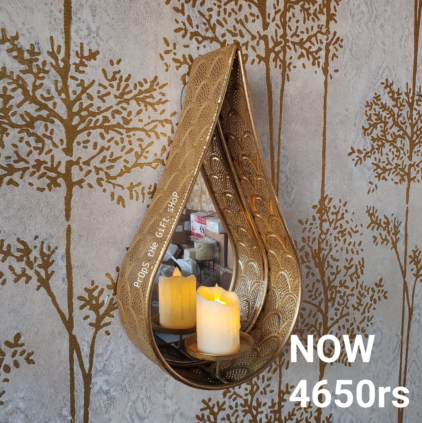 teardrop-shaped metal candle holder