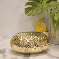 Metallic plastic pebble tissue holder