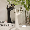 Modern Ceramic Hand Sculpture with Metallic Orbs