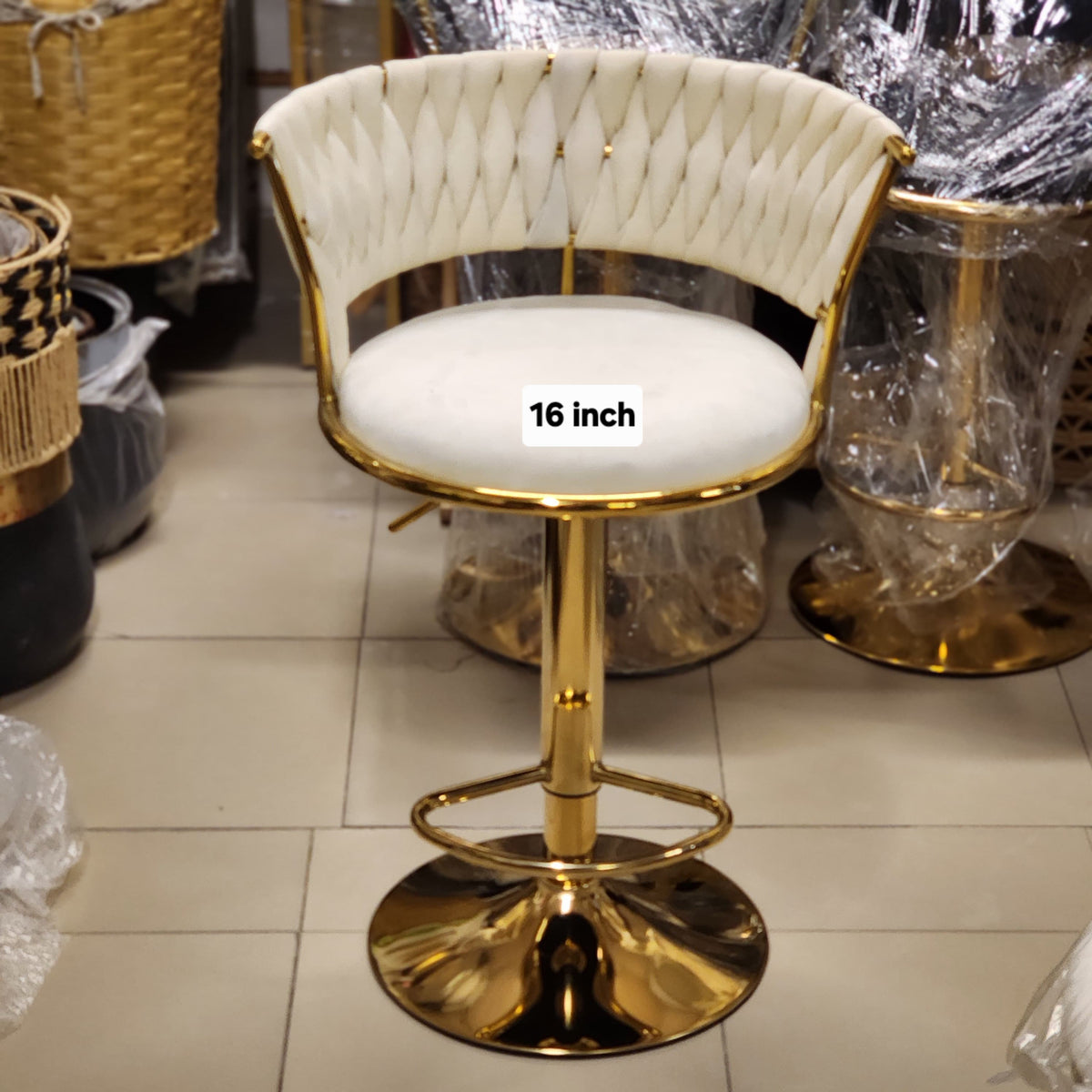 woven velvet bar stool with a gold pedestal base