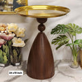 pedestal side table with a brass metal tray top and wooden conical/sculptural base.