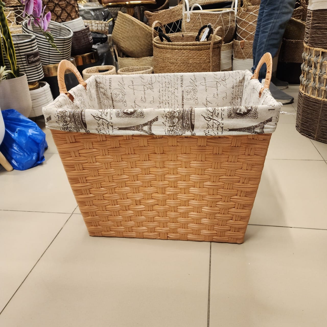 tapered rectangular wicker storage basket with a fabric liner