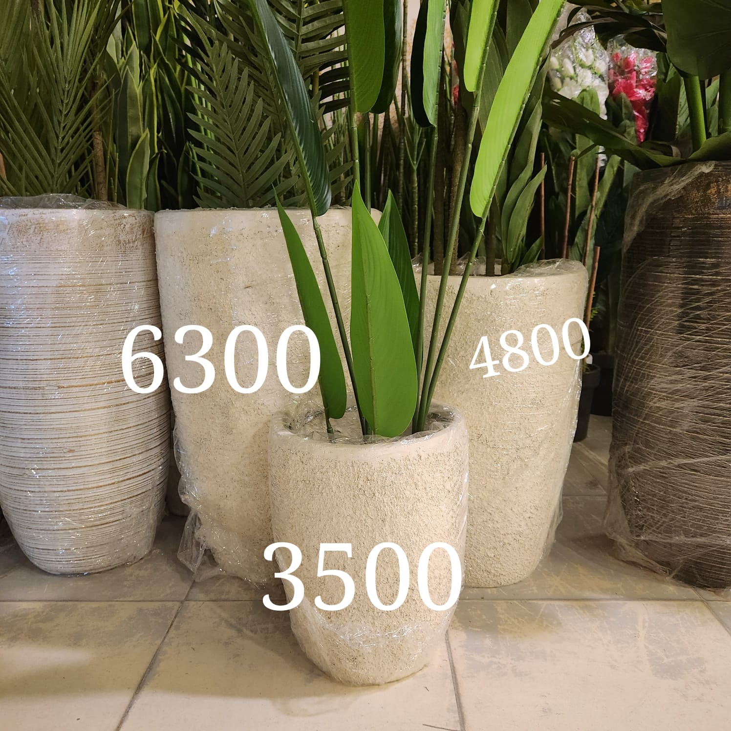 egg shaped planter pots Fiberstone Egg Planter or a U-Shaped Textured Pot