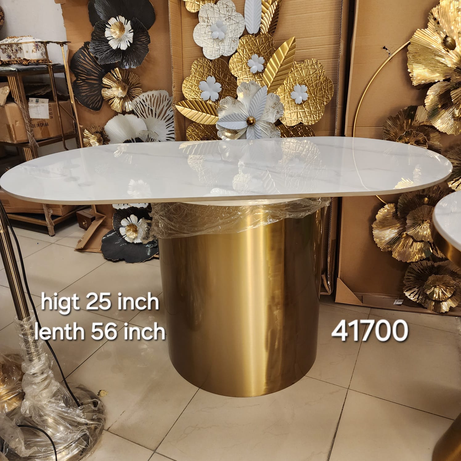 Marble Top Oval Dining Table with a Gold Pedestal Base