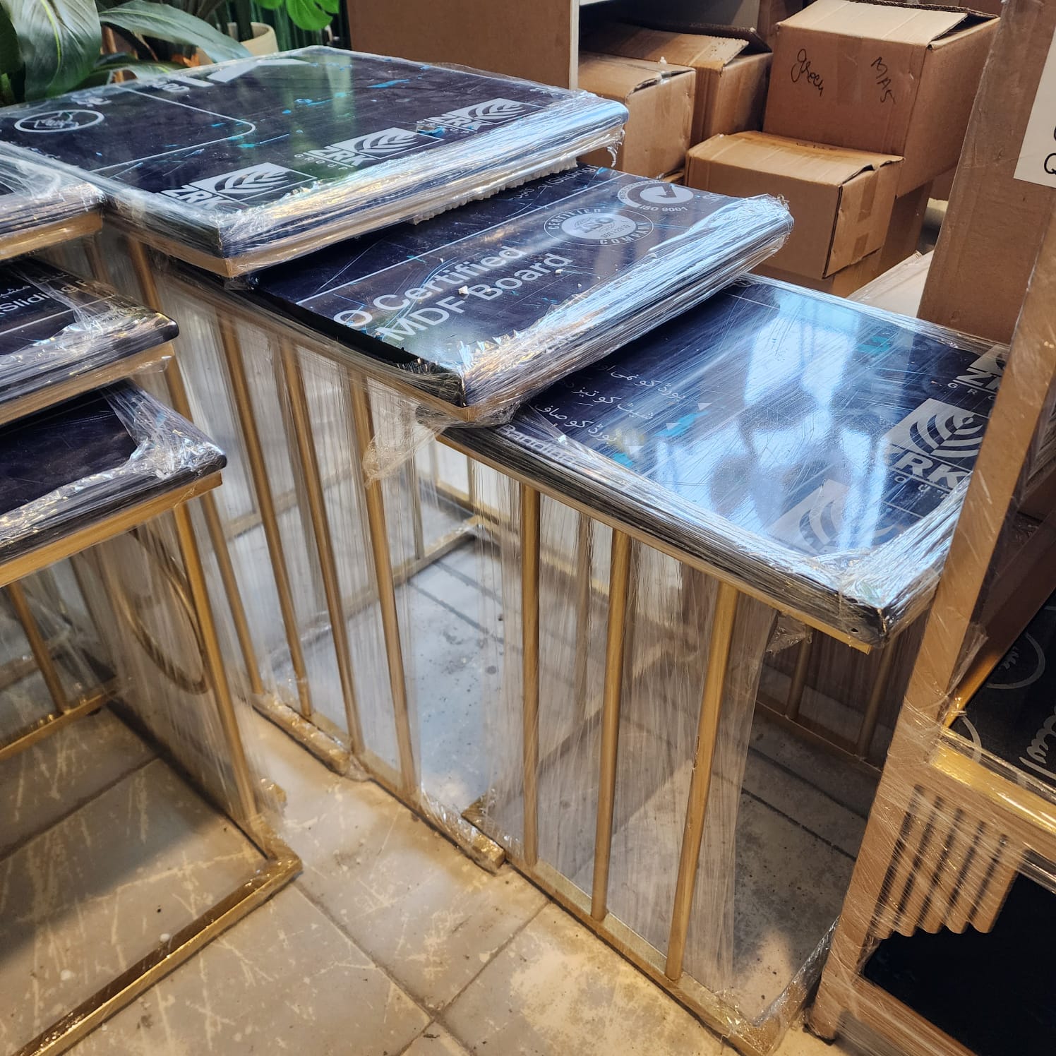 Gold-finished metal frames nesting tables