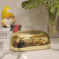 Metallic plastic pebble tissue holder