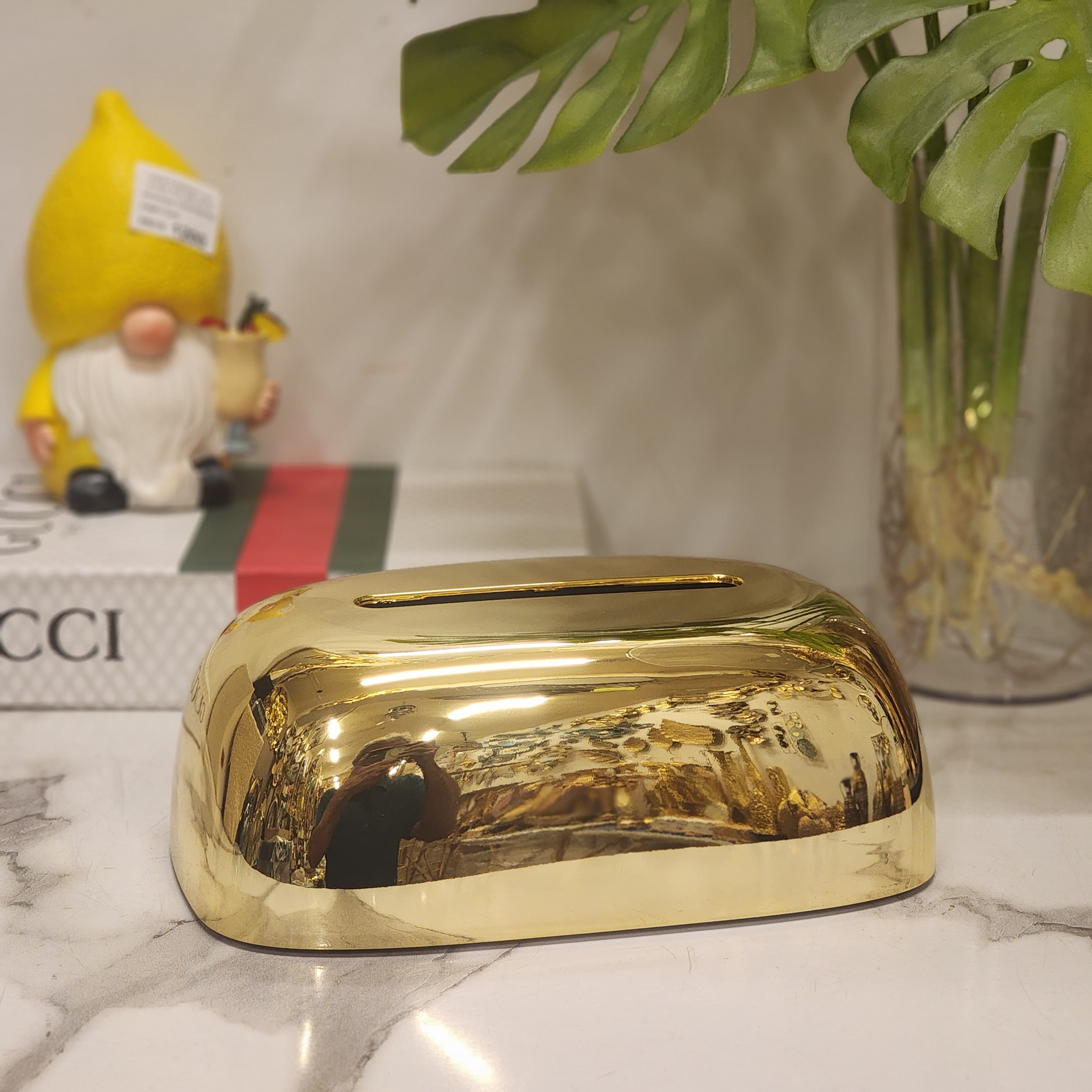 Metallic plastic pebble tissue holder