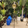vintage industrial moving gear tripod floor clock