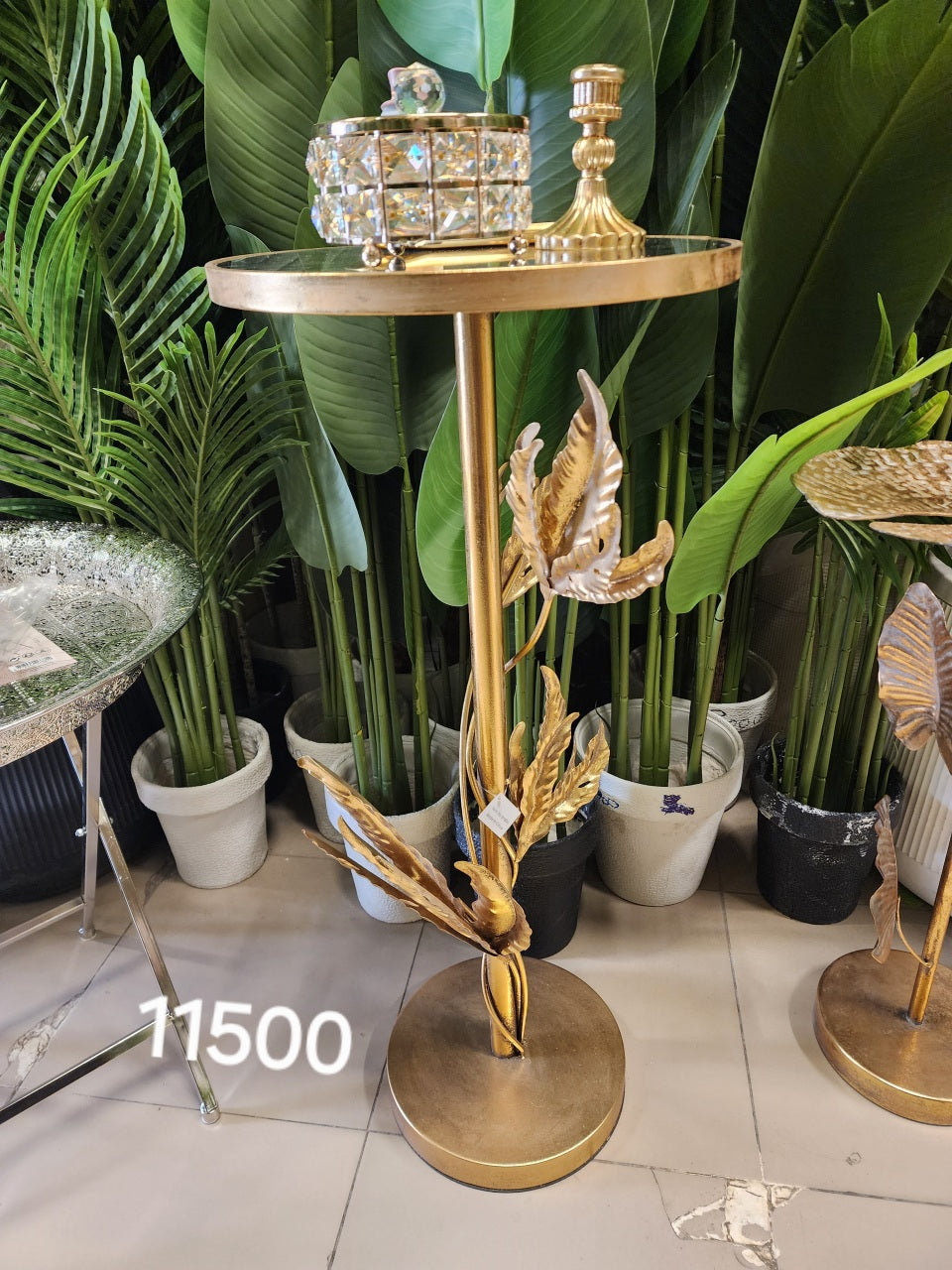 Gold leaf-accented pedestal side table