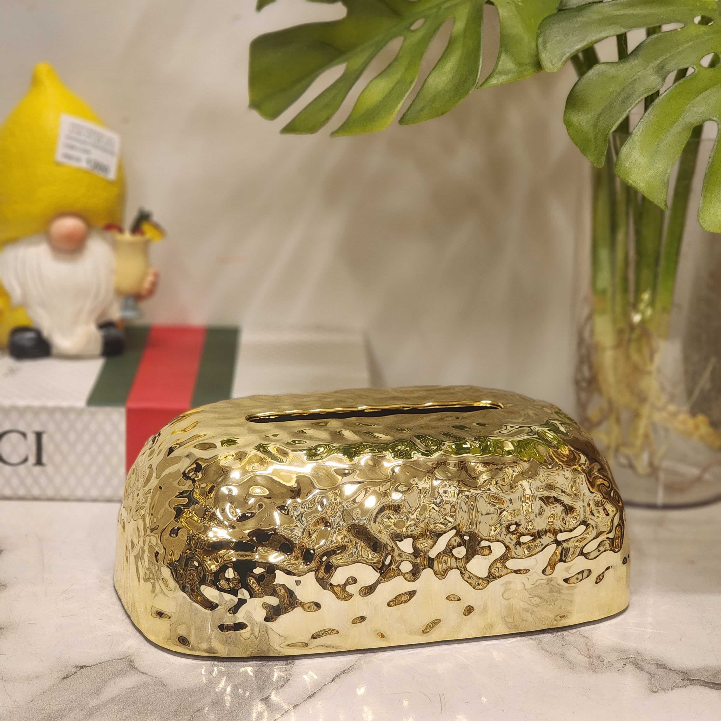 Metallic textured plastic pebble tissue holder