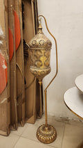 Moroccan-style floor lantern or a Hanging Pierced Metal Floor Lamp