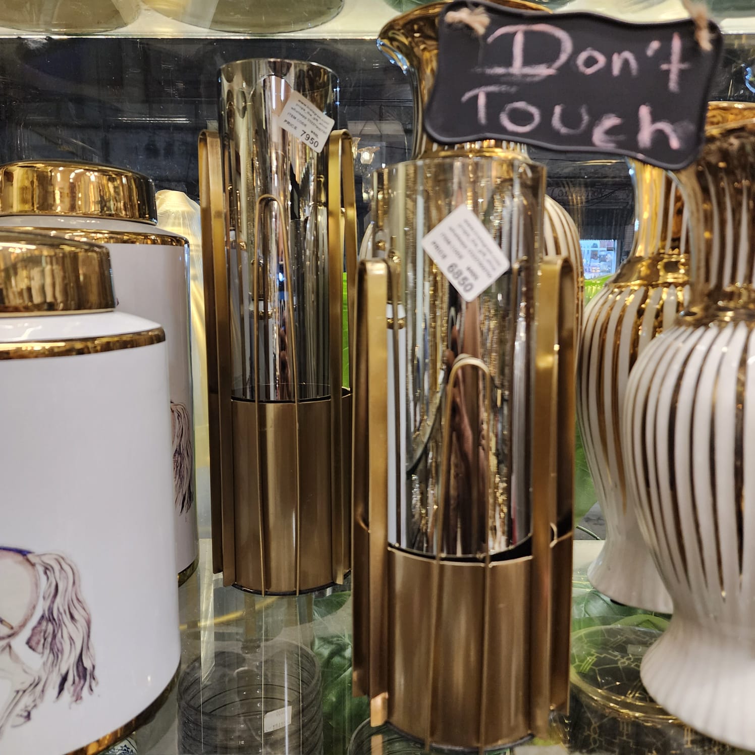 modern metal-caged glass vases