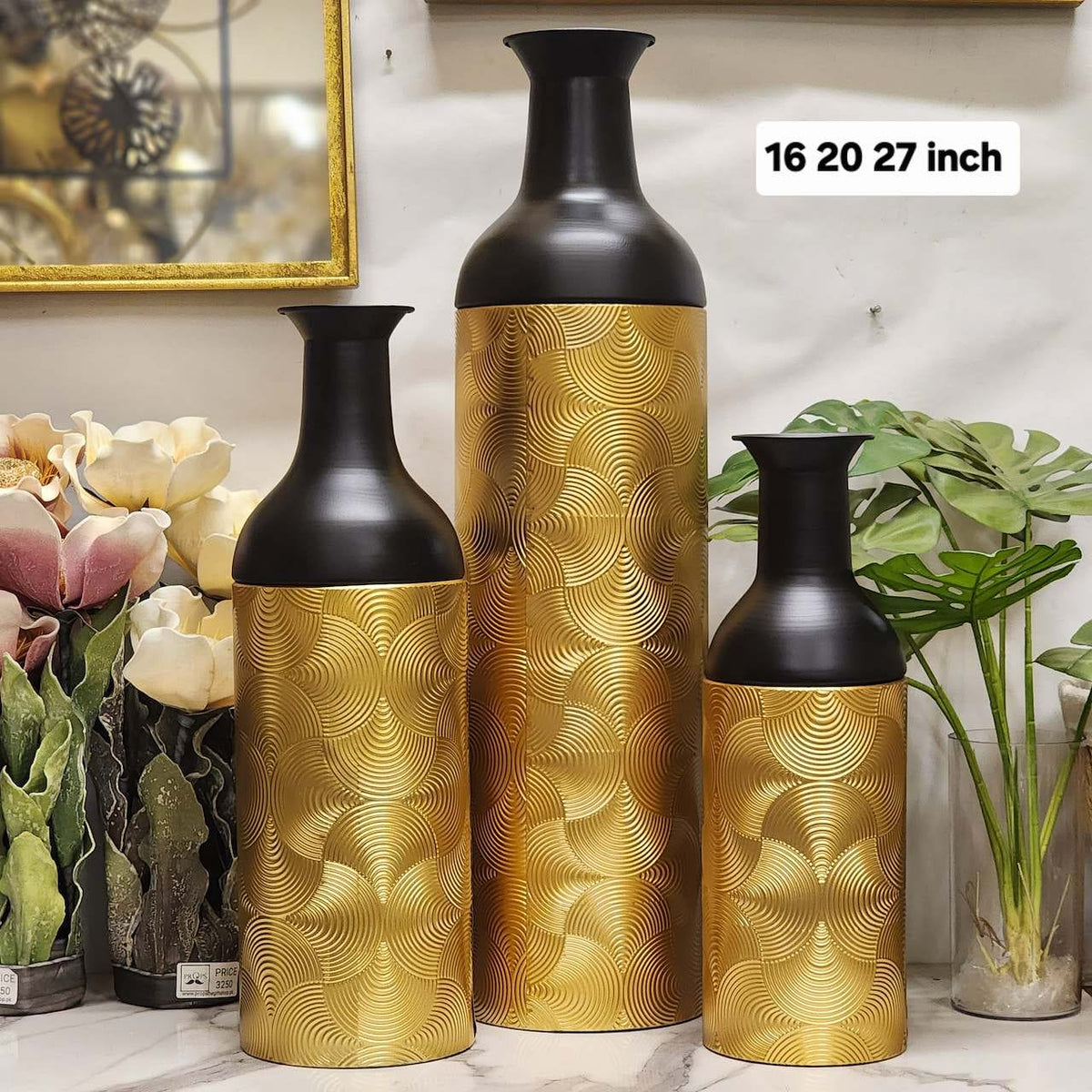 textured gold and matte black metal floor/table vases featuring a scalloped
