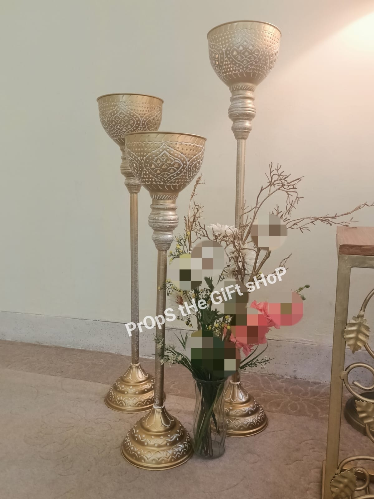 trio of embossed metal candle stands