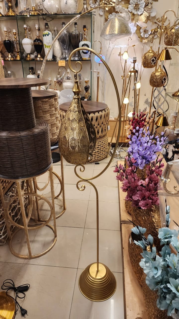 floor-standing metal lantern with an arched stand