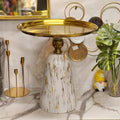 faux-marble and gold pedestal cake stand