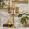 3-arm gold candelabra with glass hurricane shades