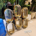 Hollywood Regency style interconnected pill-shaped wall mirror with built-in candle holders